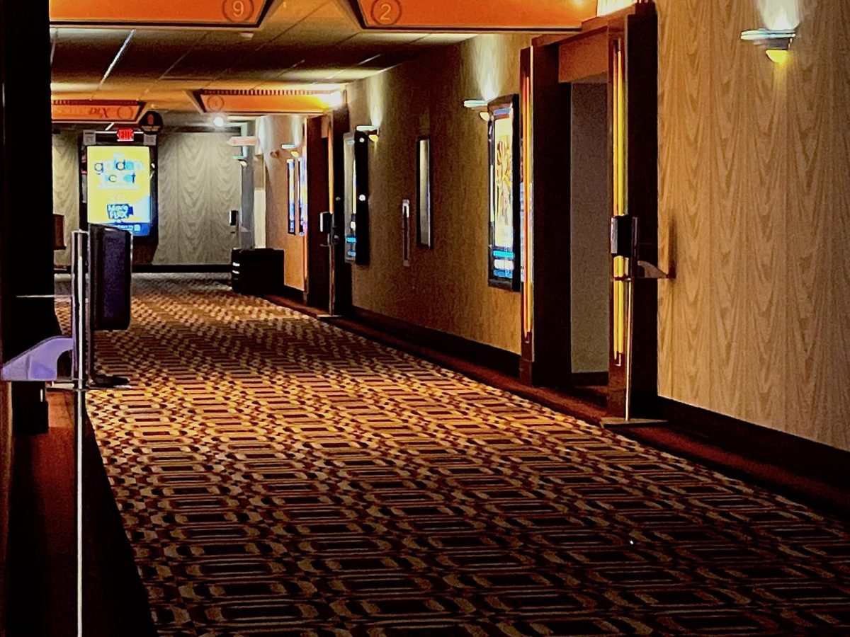 Frequently active hallways now stand silent as few visitors walk them (pictured left).