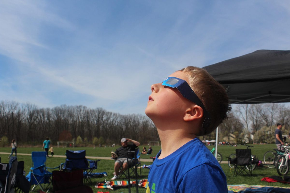 Member of the Worthington community watches the Solar Eclipse.