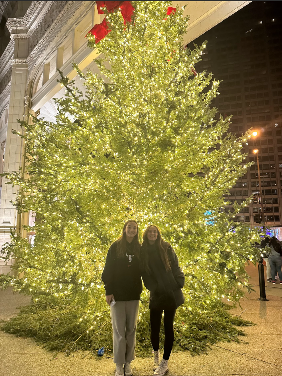 Ella and Kate Schumacher in front of a large Christmas tree in Chicago