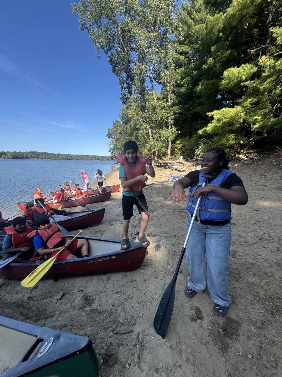 Afia with campers preparing for canoeing 