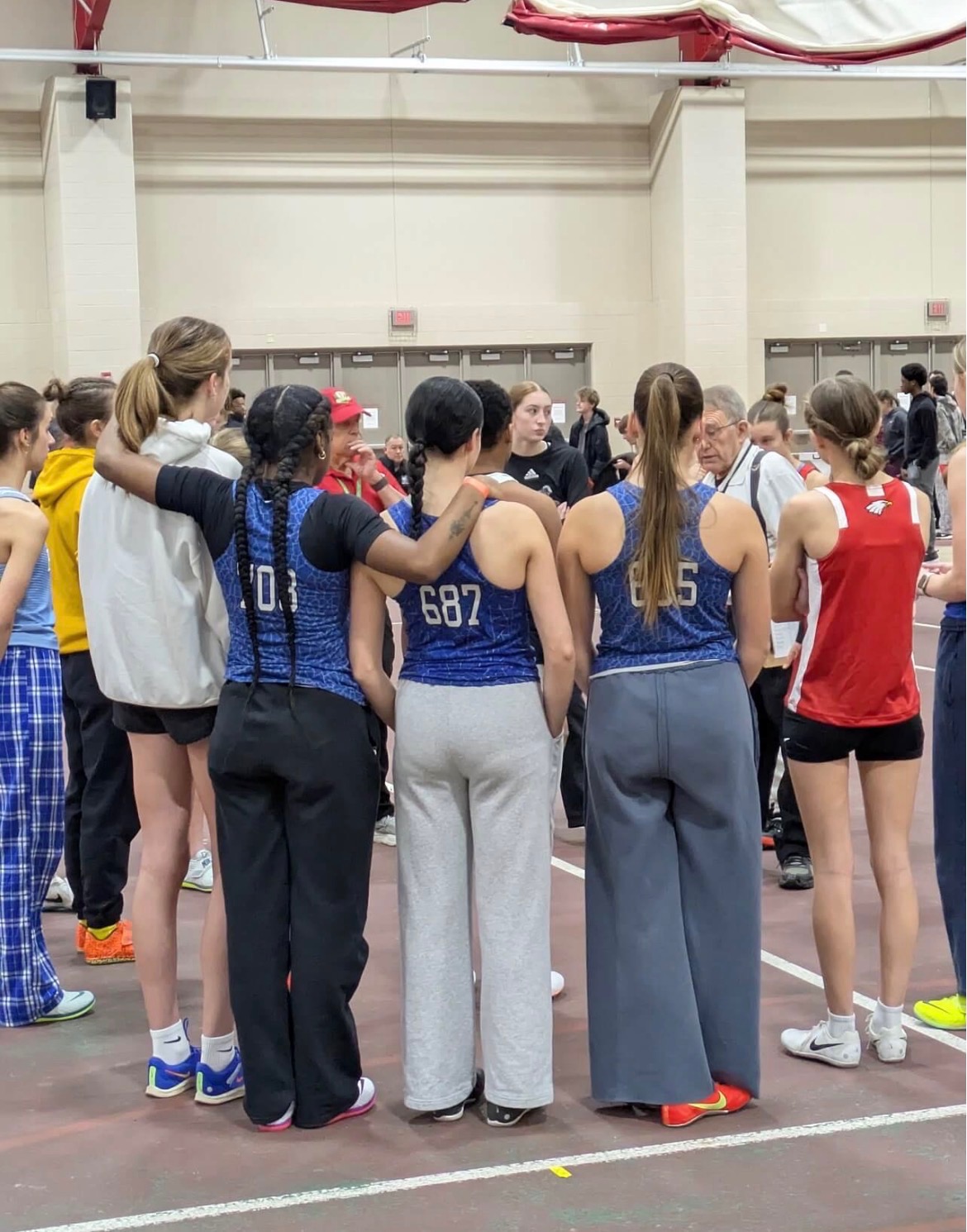 WKHS indoor track and field athletes at an indoor meet.