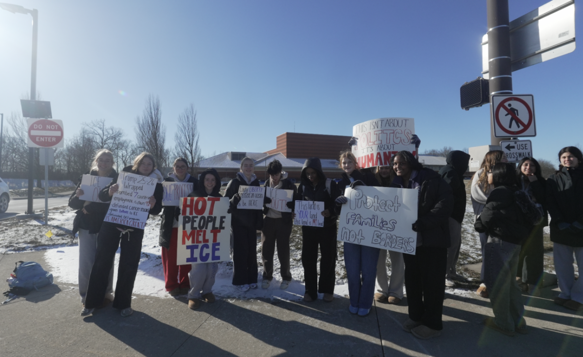 Kilbourne Students holding their handmade signs at the WKHS Walkout Against Ice